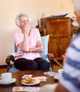 Theres still so much to laugh about. a happy senior woman laughing during a card game with her friends in a retirement Royalty Free Stock Photo