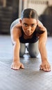 Theres strength in serenity. Portrait of a fit young woman working out in a gym. Royalty Free Stock Photo