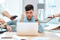 Theres too much to do, and too little time. a young businessman looking stressed out in a demanding office environment.