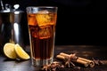 a thermal glass of hot herbal tea next to a cold cola drink Royalty Free Stock Photo