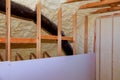 Inside wall insulation in wooden house, building under construction Royalty Free Stock Photo