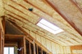 Inside wall insulation in wooden house, building under construction