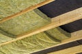 Thermal insulation mineral rock wool installation at the new building attic ceiling Royalty Free Stock Photo