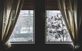 Thermal insulation window save energy bills snow fall view winter dark window curtain stay home snowing outside Royalty Free Stock Photo