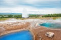 Thermal lake Blesi and eruption of Strokkur Geysir Royalty Free Stock Photo