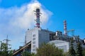 Thermal power plant, industrial chimney against a clear blue sky Royalty Free Stock Photo