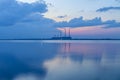 Thermal power plant and the lake at sunset