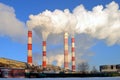 Thermal power plant, smoke from the chimney against blue sky