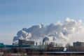 Thermal power plant. Thick grey smoke comes from the chimney