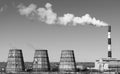 Thermal power station with smoking chimneys. View from afar.