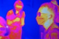 Thermal scanner, camera detecting infected people. Infrared thermography image showing the heat emission