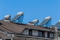 Thermal solar panels and water heater alternative technologies of water heating on the roof of the hotel against the blue sky Royalty Free Stock Photo