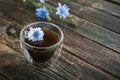 Thermo glass cup with chicory drink on brown wooden table with copy space Royalty Free Stock Photo