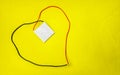 Thermo Peltier cooler make heart shape in yellow background Royalty Free Stock Photo