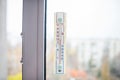 A thermometer attached to the window shows that it is 13 degrees Celsius outside Royalty Free Stock Photo