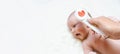 Thermometer baby fever child banner. Doctor check cold flu baby temperature care from electronic thermometer. Fever baby