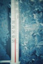 Thermometer Cold. The view from the window - Ice Pattern and Thermometer cold. Cold outside the window - temperature minus 41 degr Royalty Free Stock Photo