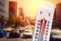 Thermometer in front of cars and traffic Royalty Free Stock Photo