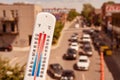 Thermometer in front of cars and traffic Royalty Free Stock Photo