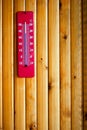 Thermometer heat on wood background