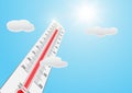 Thermometer with high temperature against the sun on blue sky background