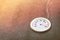 Thermometer with high temperature on the street with glowing sun background Royalty Free Stock Photo