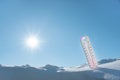 The thermometer lies on the snow in winter showing a negative temperature.Meteorological conditions in a harsh climate in winter Royalty Free Stock Photo