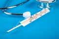Thermometer and phonendoscop on a blue background Royalty Free Stock Photo