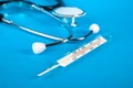 Thermometer and phonendoscop on a blue background Royalty Free Stock Photo