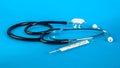 Thermometer and phonendoscop on a blue background Royalty Free Stock Photo