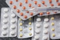 Thermometer with pills as background Royalty Free Stock Photo