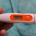 A thermometer shown the result of body temperature measure of 39 degree celcius