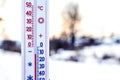 Thermometer shows 10 degrees of frost. Thermometer in the background of the winter landscape. Weather forecast_ Royalty Free Stock Photo