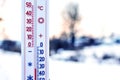 The thermometer shows 30 degrees of frost. Thermometer in the background of the winter landscape. Weather forecast. Very cold. Royalty Free Stock Photo