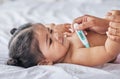 Thermometer, sick and baby on bad with fever, cold and flu symptoms in bedroom with tool to check temperature. Family Royalty Free Stock Photo