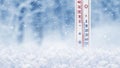 Thermometer in the snow on a background of winter forest shows 25 degrees below zero Royalty Free Stock Photo