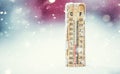 Thermometer on snow shows low temperatures in celsius or farenheit Royalty Free Stock Photo