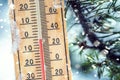 Thermometer on snow shows low temperatures in celsius or farenheit Royalty Free Stock Photo