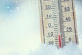 Thermometer on snow shows low temperatures under zero. Low tempe Royalty Free Stock Photo