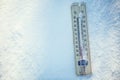 Thermometer on snow shows low temperatures under zero. Low temperatures in degrees Celsius and fahrenheit. Royalty Free Stock Photo