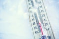 Thermometer on snow shows low temperatures under zero. Low temperatures in degrees Celsius and fahrenheit. Royalty Free Stock Photo