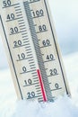 Thermometer on snow shows low temperatures zero. Low temperature Royalty Free Stock Photo