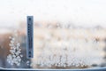 Thermometer on winter window with frosts Royalty Free Stock Photo