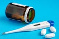 Thermometr and pills Royalty Free Stock Photo