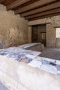 Thermopolium of Asellina, cook-shop in ruins of ancient city, Pompeii, Naples, Italy Royalty Free Stock Photo