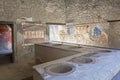 Thermopolium in Pompeii, ancient Roman city in Italy Royalty Free Stock Photo