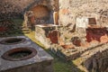 Thermopolium or tavern. Herculaneum. Naples. Italy Royalty Free Stock Photo