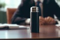 Thermos On The Desk In Closeup Against Man In Business Suit. Generative AI