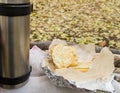 thermos of hot tea, coffee and wrapped in foil sandwiches for a picnic in the Park in autumn Royalty Free Stock Photo