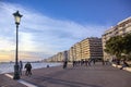 Thessaloniki, Greece, April 28, 2023: pedestrian promenade on the quay shore at the Mediterranean Sea in the evening sun, popular